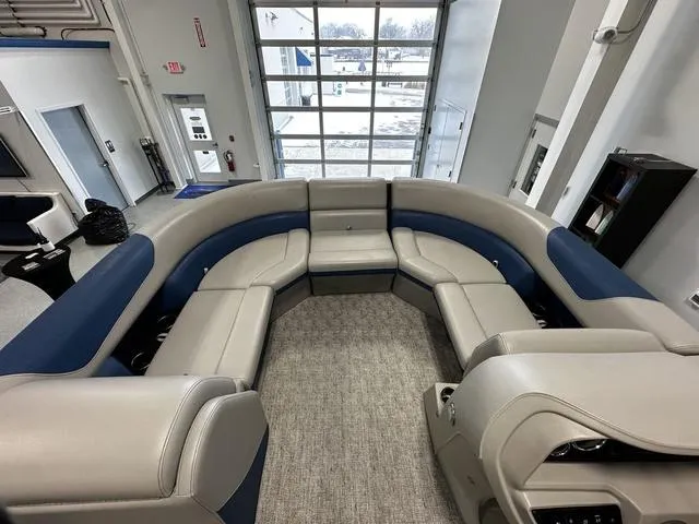 Slide: The Image of 2024 South Bay 222RS LE 2.75 pontoon boat interior with plush seating. - 8