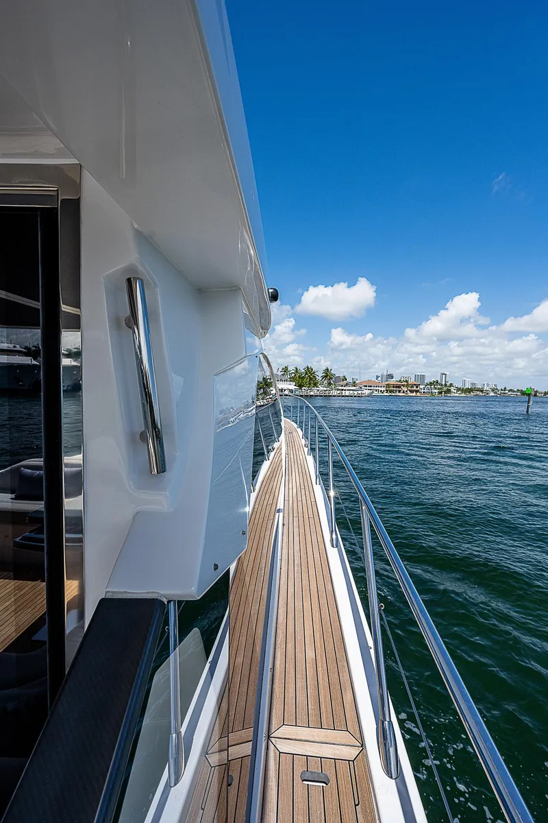 Slide: The Image of 2022 Azimut S6 yacht side deck view with ocean and blue sky. - 11