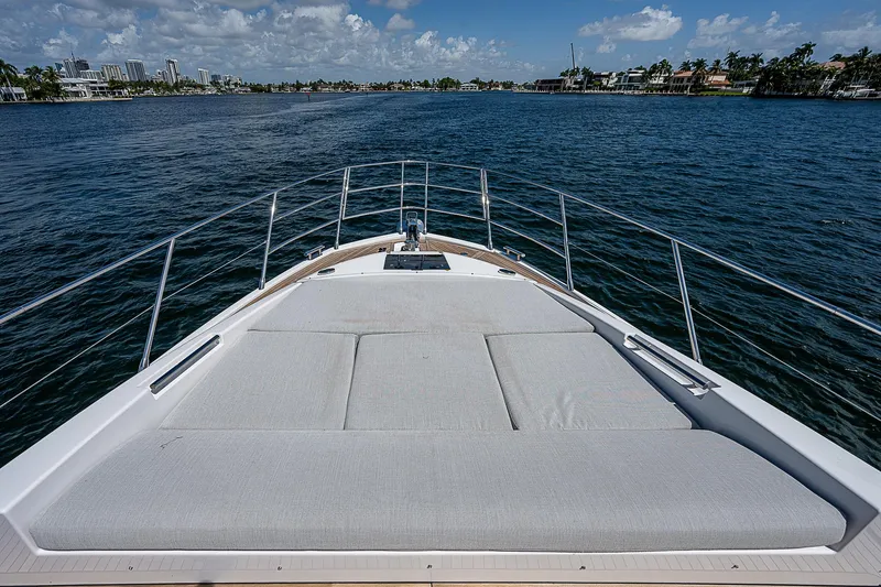 Slide: The Image of 2022 Azimut S6 yacht bow with sunbed, cruising on a sunny day. - 14