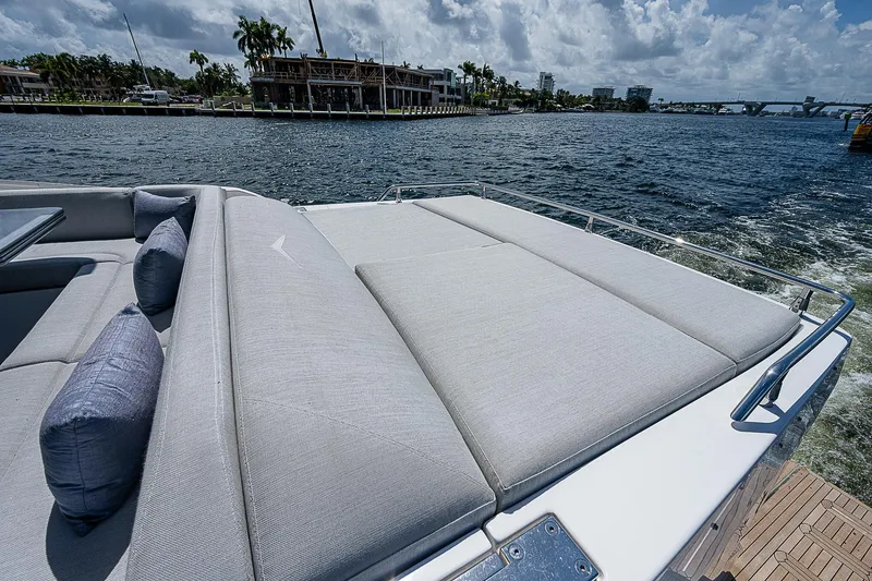 Slide: The Image of 2022 Azimut S6 yacht with spacious sunbathing area on deck, cruising on a sunny day. - 23