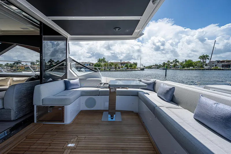 Slide: The Image of Luxurious 2022 Azimut S6 yacht with elegant seating and scenic waterfront view. - 27