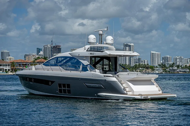 Slide: The Image of 2022 Azimut S6 yacht cruising on water with city skyline in background. - 3
