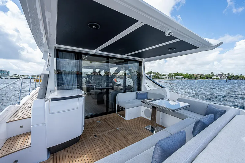 Slide: The Image of 2022 Azimut S6 yacht deck with modern seating and ocean view. - 34