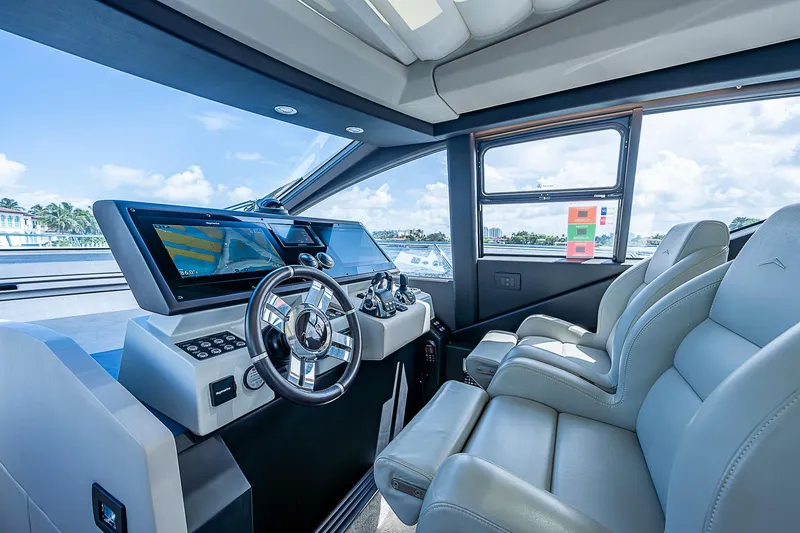Slide: The Image of 2022 Azimut S6 yacht cockpit with modern controls and luxurious seating. - 36