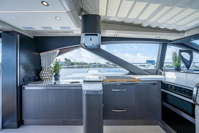 Slide: The Image of Luxurious interior of 2022 Azimut S6 yacht with modern kitchen design and scenic ocean view. - 40