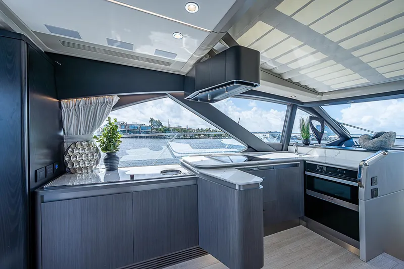 Slide: The Image of Luxurious interior of 2022 Azimut S6 yacht with modern kitchen and scenic window views. - 41