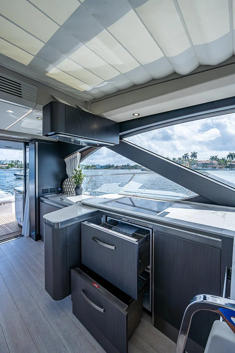 Slide: The Image of Interior of 2022 Azimut S6 yacht with modern kitchen and scenic water view. - 43