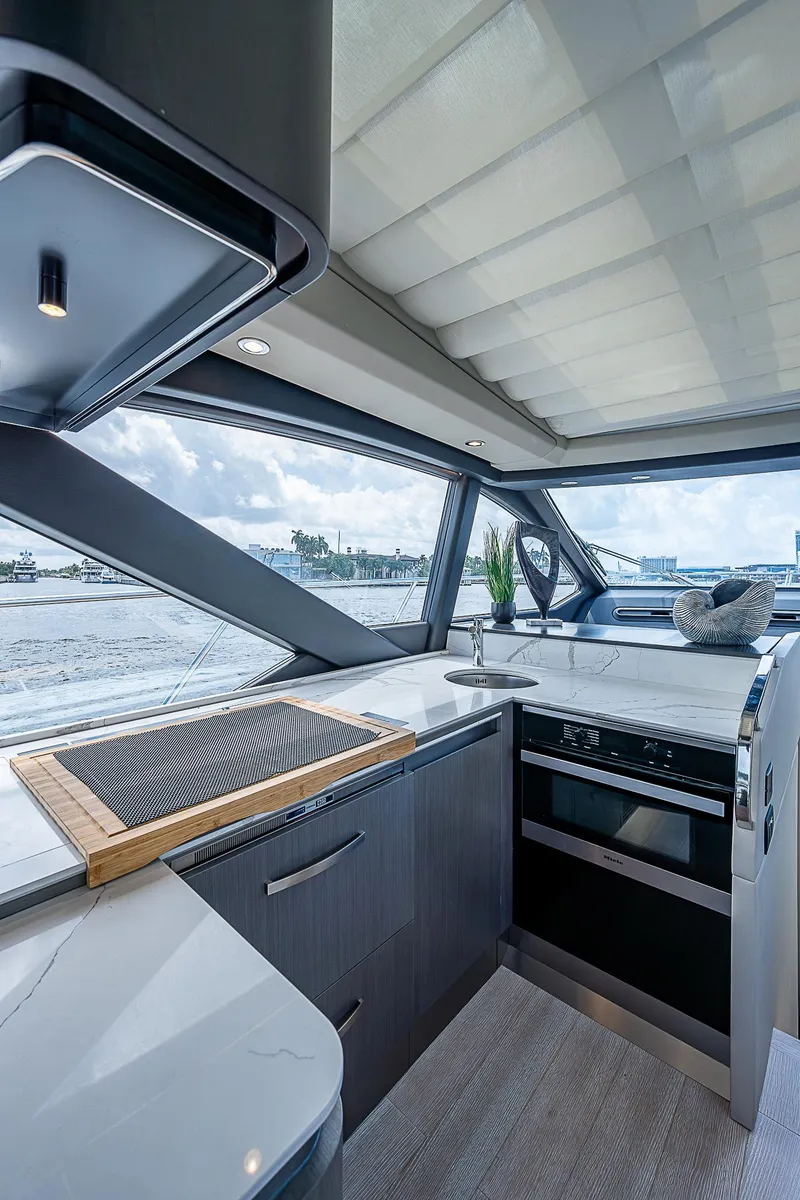Slide: The Image of Modern kitchen interior of 2022 Azimut S6 yacht with sleek design and ocean view. - 47