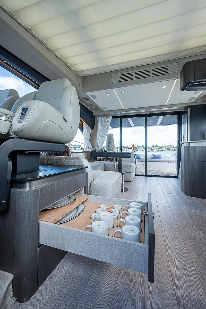 Slide: The Image of Luxurious interior of 2022 Azimut S6 yacht with elegant seating and open drawer. - 48