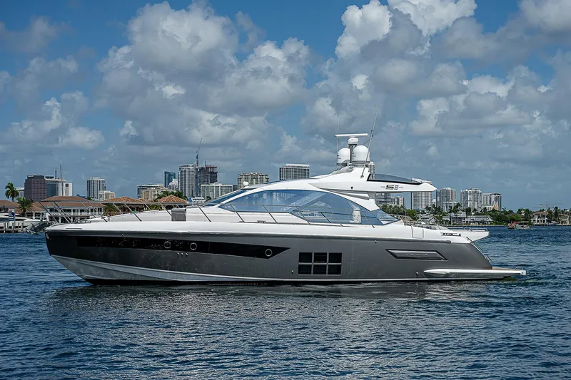 Slide: The Image of 2022 Azimut S6 yacht cruising on a sunny day with city skyline backdrop. - 7