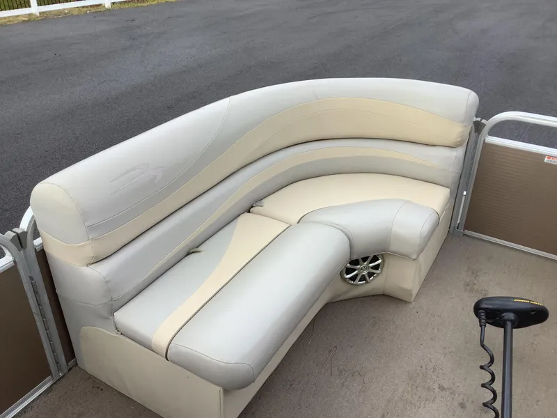 Slide: The Image of 2013 Bennington 2275 boat interior with beige and cream seating. - 12