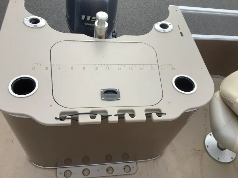 Slide: The Image of 2013 Bennington 2275 boat console with cup holders and Yamaha 115 engine. - 16