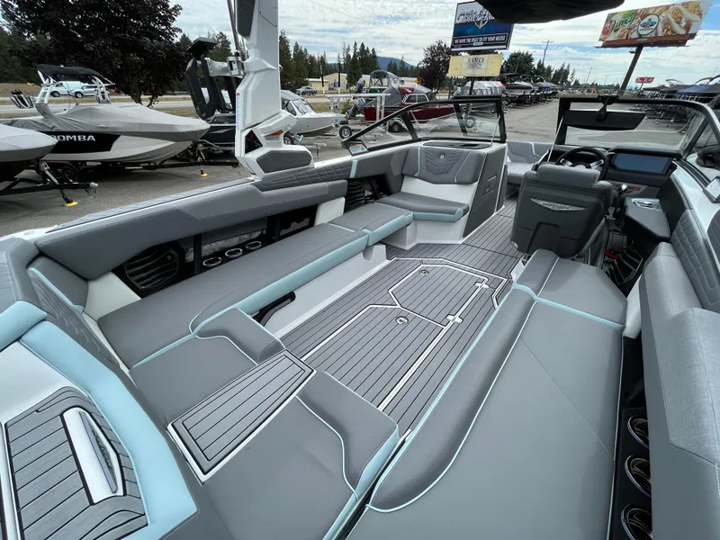 Slide: The Image of 2024 Nautique Super Air G25 interior with sleek seating and modern design. - 11