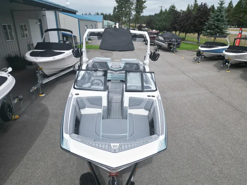 Slide: The Image of 2024 Nautique Super Air G25 boat displayed outdoors at a dealership. - 5