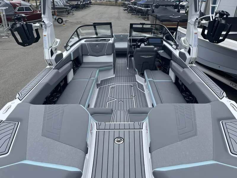 Slide: The Image of 2024 Nautique Super Air G25 boat interior with sleek gray seating and modern design. - 7