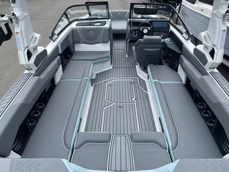 Slide: The Image of 2024 Nautique Super Air G25 interior with spacious seating and modern design. - 8