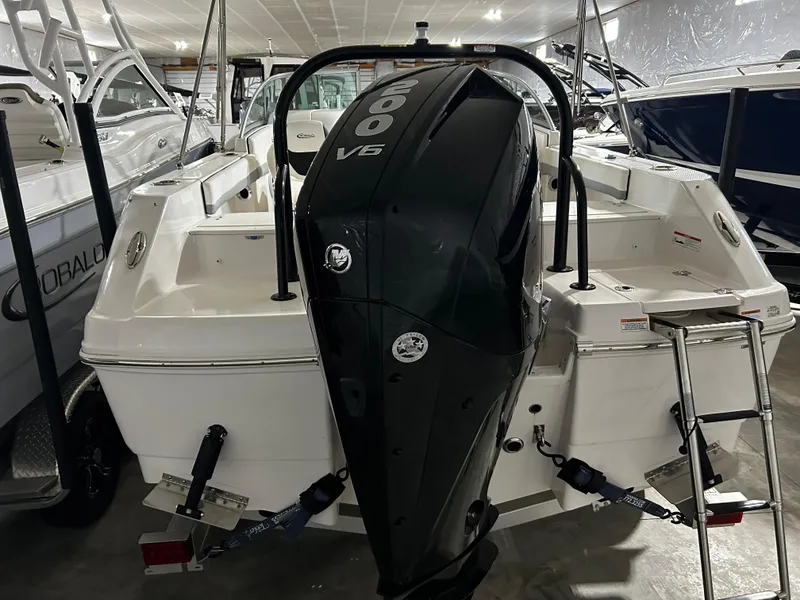 Slide: The Image of 2023 Robalo 207 boat with powerful 200 V6 engine in showroom. - 3