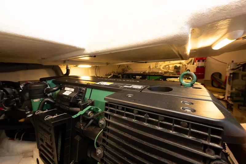 Slide: The Image of Engine room of 2017 Beneteau Gran Turismo 49 yacht, showcasing mechanical components. - 10