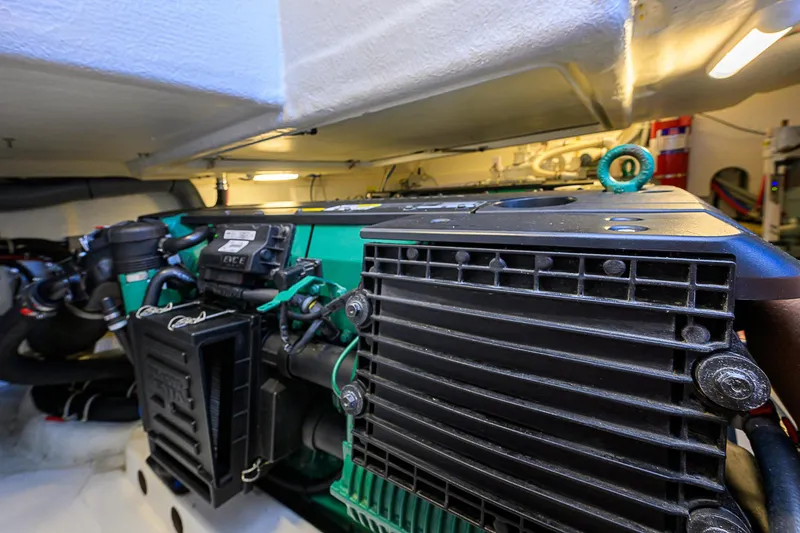 Slide: The Image of Engine room of 2017 Beneteau Gran Turismo 49 yacht, showcasing detailed machinery. - 18