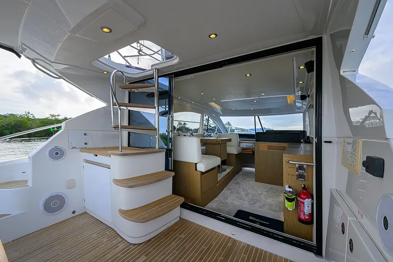 Slide: The Image of 2017 Beneteau Gran Turismo 49 yacht interior with modern design and wooden accents. - 21