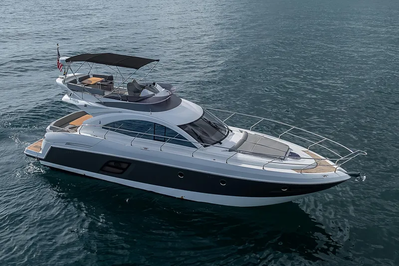 Slide: The Image of 2017 Beneteau Gran Turismo 49 yacht cruising on open water. - 28