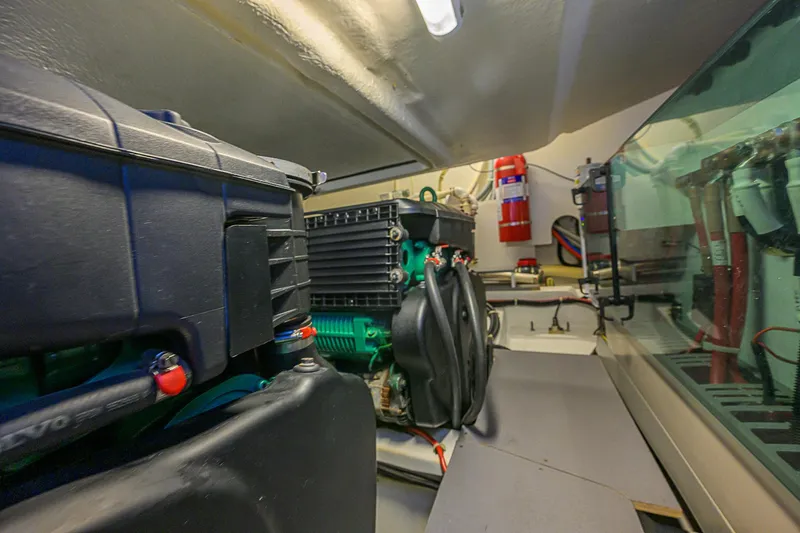 Slide: The Image of Engine room of 2017 Beneteau Gran Turismo 49 yacht, featuring machinery and safety equipment. - 32