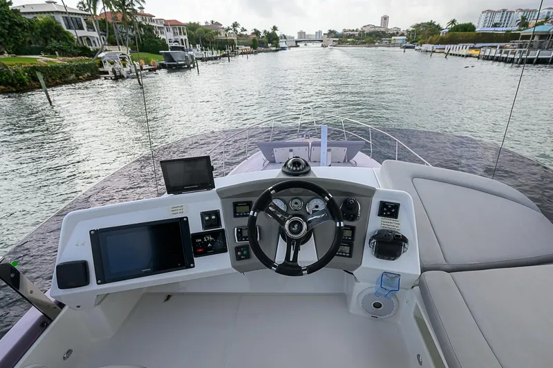 Slide: The Image of Cockpit view of 2017 Beneteau Gran Turismo 49 yacht on a scenic waterway. - 52