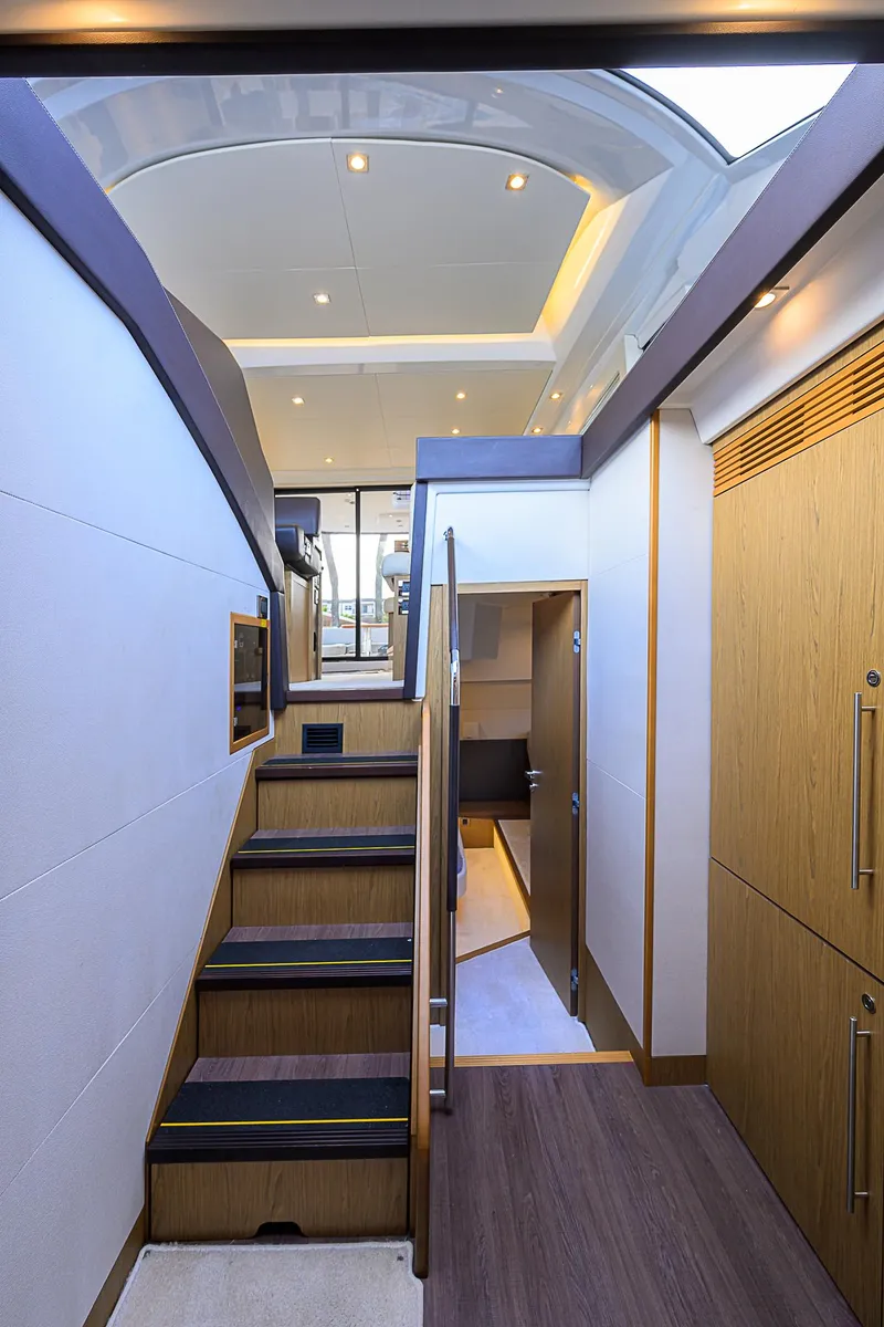 Slide: The Image of Interior of 2017 Beneteau Gran Turismo 49 yacht, featuring modern design and wooden finishes. - 57