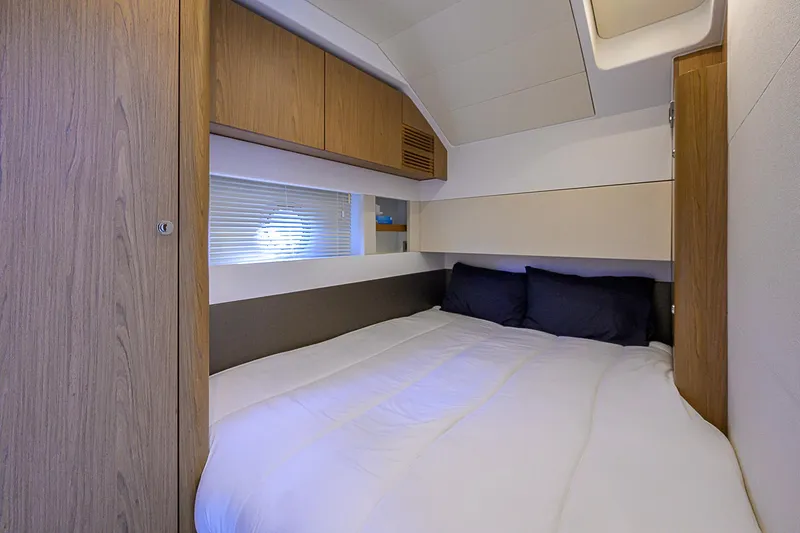 Slide: The Image of Interior cabin of 2017 Beneteau Gran Turismo 49 yacht, featuring a cozy bed. - 66
