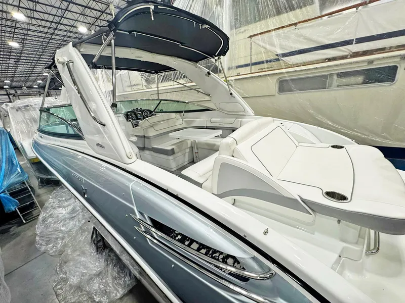 Slide: The Image of 2013 Formula 290 Bowrider boat in storage, featuring sleek design and spacious seating. - 36