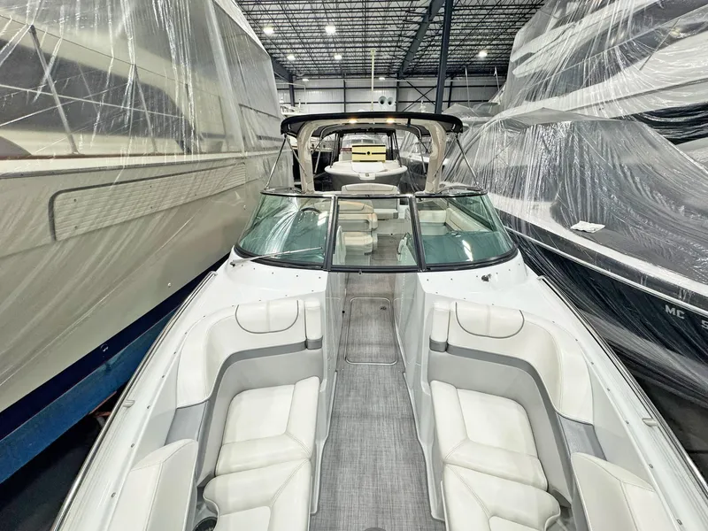 Slide: The Image of 2013 Formula 290 Bowrider in storage, showcasing spacious seating and sleek design. - 40