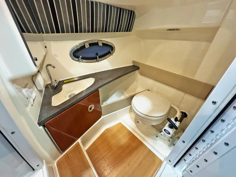 Slide: The Image of Luxurious bathroom in 2013 Formula 290 Bowrider boat with sink and toilet. - 47