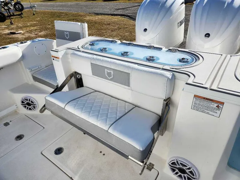 Slide: The Image of 2025 Sea Fox 288 Commander boat interior with seating and dual engines. - 11