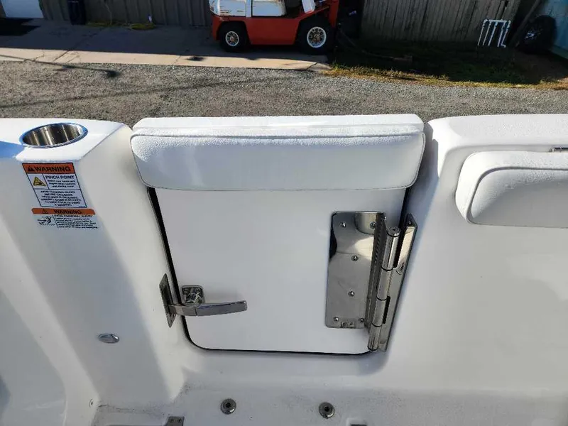 Slide: The Image of 2025 Sea Fox 288 Commander boat interior with white cushioned seating and stainless steel hardware. - 15