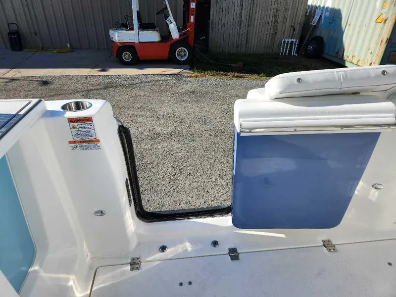 Slide: The Image of 2025 Sea Fox 288 Commander boat interior with open side door and seating. - 16