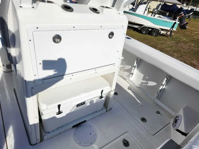 Slide: The Image of 2025 Sea Fox 288 Commander boat interior with storage and cooler. - 17
