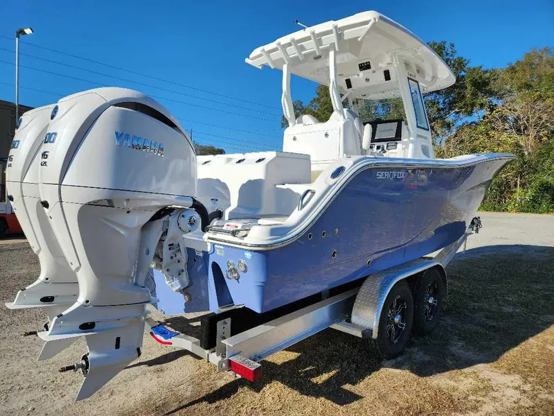 Slide: The Image of 2025 Sea Fox 288 Commander boat with dual Yamaha engines on a trailer. - 5
