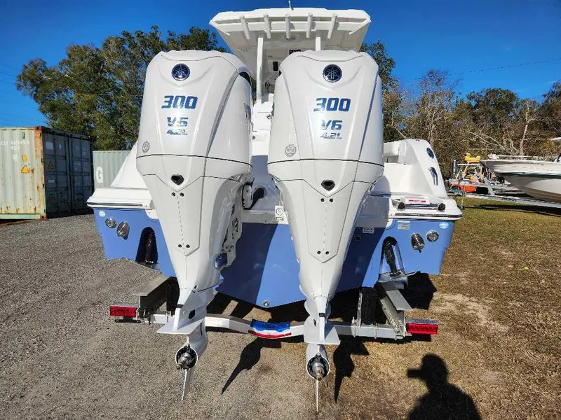 Slide: The Image of 2025 Sea Fox 288 Commander with twin 300 V6 outboard engines, rear view. - 6