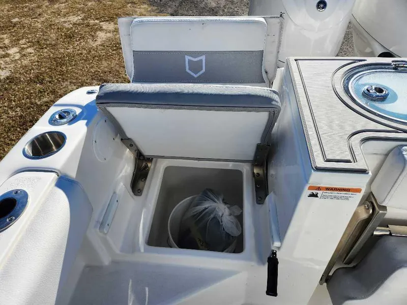 Slide: The Image of 2025 Sea Fox 288 Commander boat interior with storage compartment and seating. - 9
