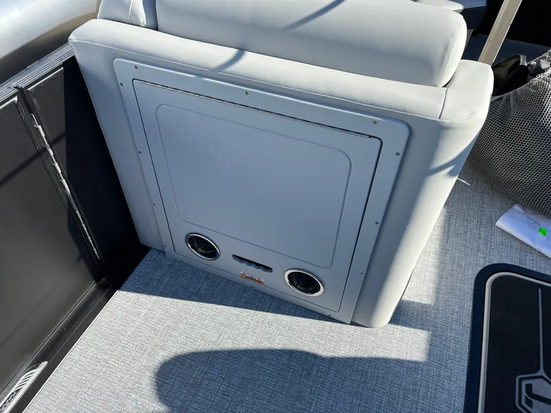 Slide: The Image of 2025 Harris Cruiser 230 boat interior with gray seating and carpeted flooring. - 11