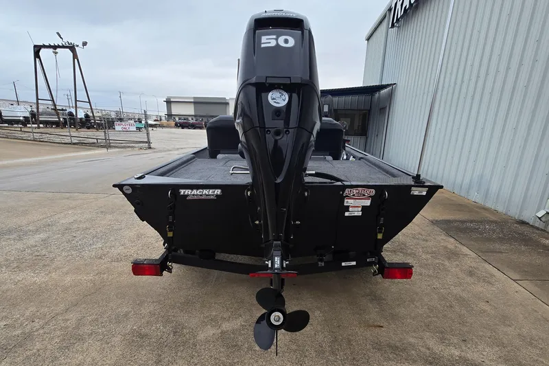 Slide: The Image of 2025 Tracker Bass Tracker Classic XL boat with 50 HP engine, rear view. - 3