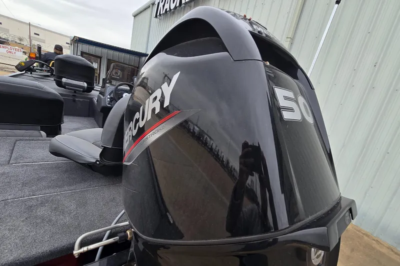 Slide: The Image of 2025 Tracker Bass Tracker Classic XL with Mercury 50 engine, parked outdoors. - 7