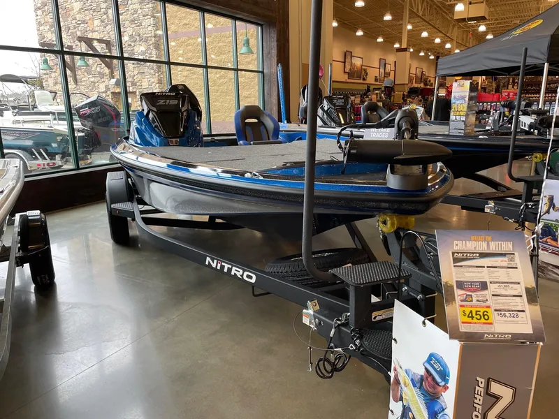 The Image of 2025 Nitro Z19 boat displayed indoors with promotional materials. - 0