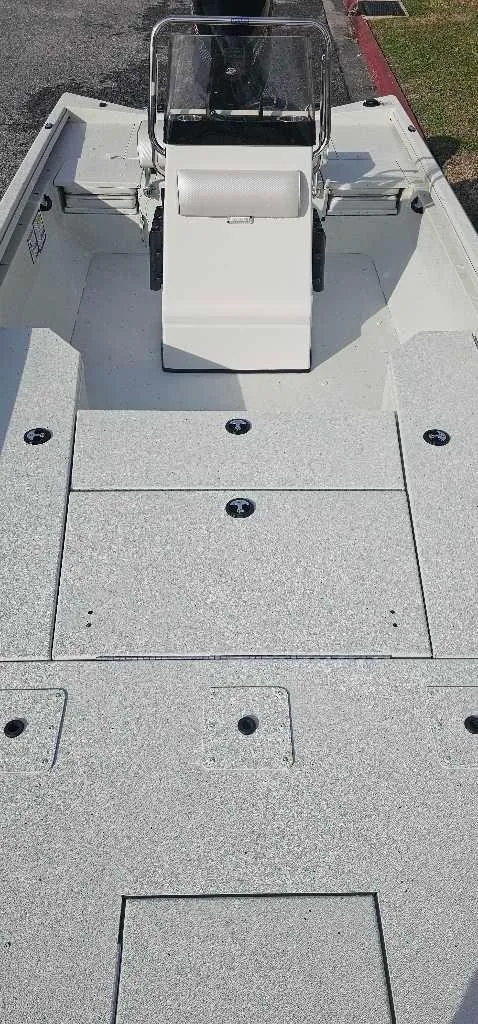 Slide: The Image of 2025 Ranger RB210 boat interior with center console and spacious deck. - 3