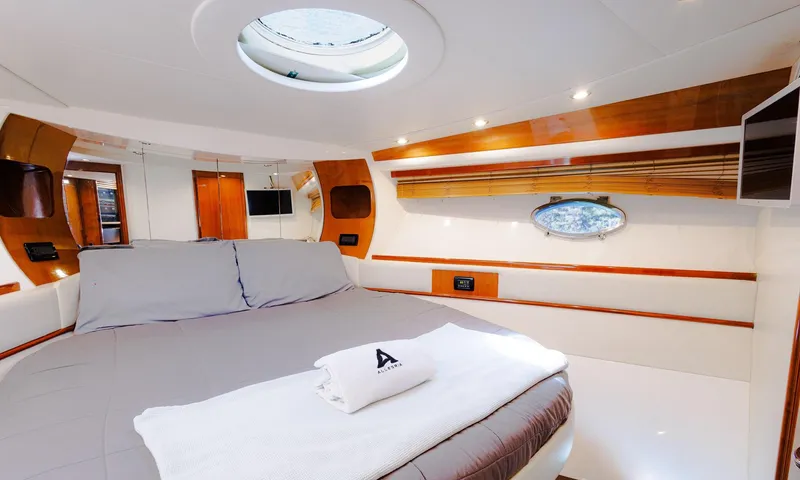 Slide: The Image of Luxurious cabin interior of 2008 Pershing 50 yacht with modern design and cozy bedding. - 15