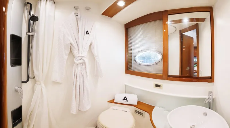 Slide: The Image of Luxurious bathroom in 2008 Pershing 50 yacht with robe, shower, and modern fixtures. - 17
