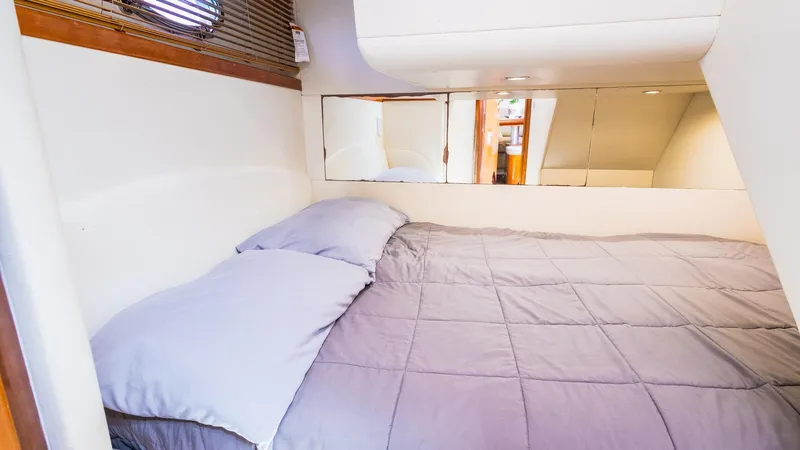 Slide: The Image of Luxurious bedroom interior of 2008 Pershing 50 yacht with cozy bedding. - 19