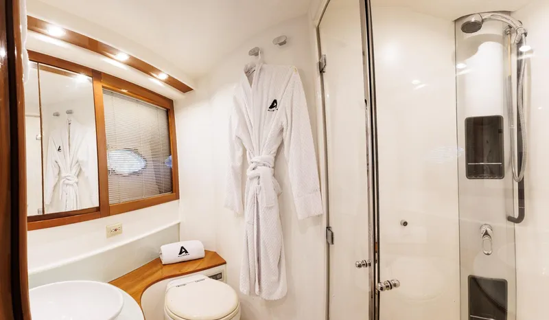 Slide: The Image of Luxurious bathroom in 2008 Pershing 50 yacht with robe and modern shower. - 20