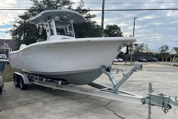 Slide: The Image of 2024 Sea Pro 262 Deluxe CC boat on trailer in parking lot. - 3