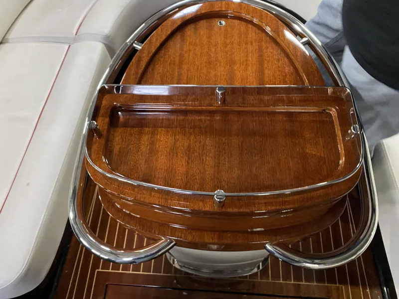 Slide: The Image of 2016 Riva Aquariva Super boat interior with polished wood and chrome details. - 6